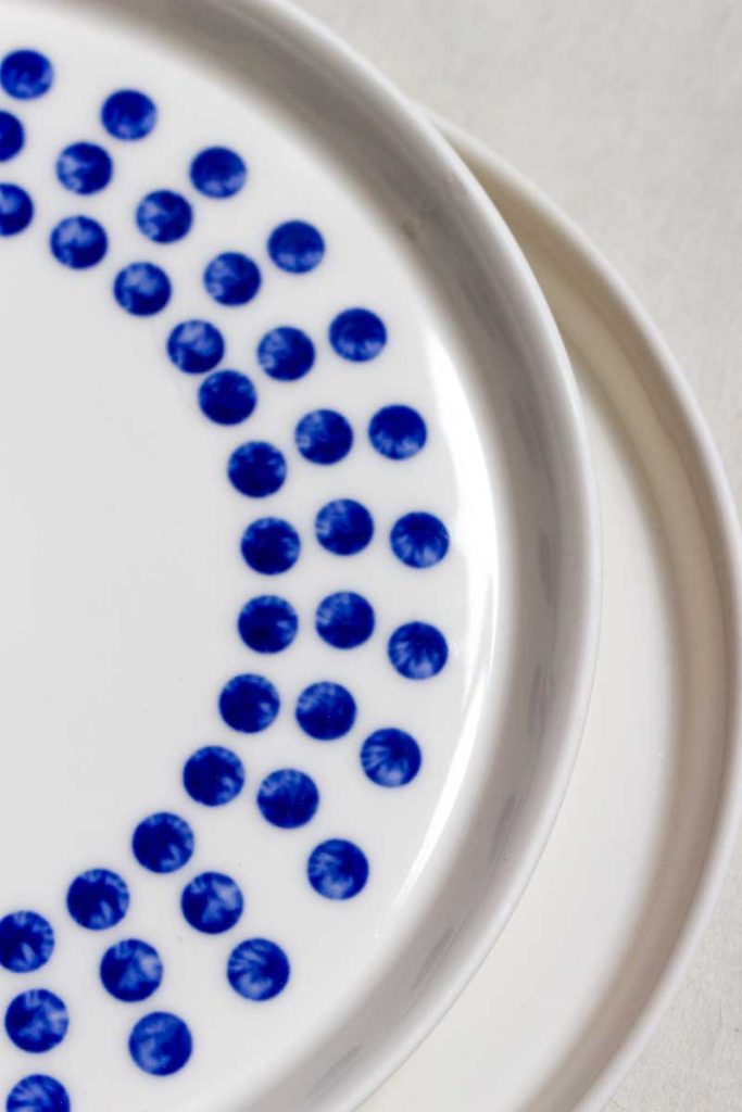 Close-up MOCA handmade ceramic dessert plate 16cm – spread blue glaze dots circular pattern detail