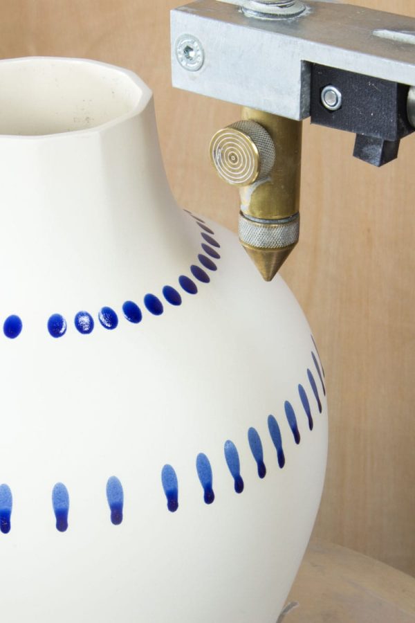 Close-up blue glaze dripping on MOCA white porcelain vase – artisan technique Eindhoven & Nantes