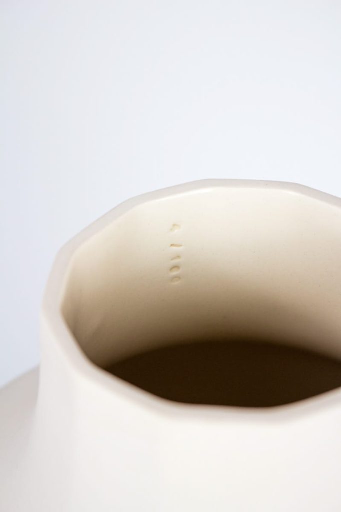 MOCA hand-numbered stamp on unique white porcelain vase – signed limited edition of 100